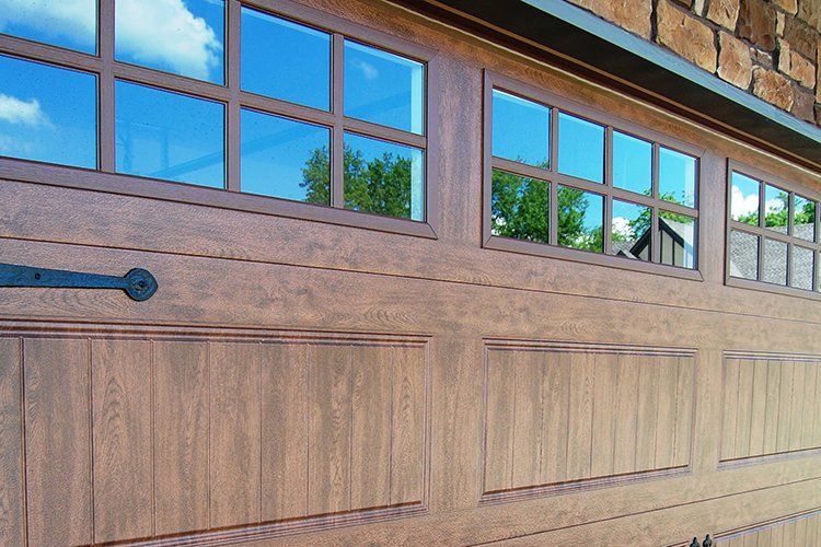 Long Wooden Garage Door by Hansman Custom Homes in Mid-MO
