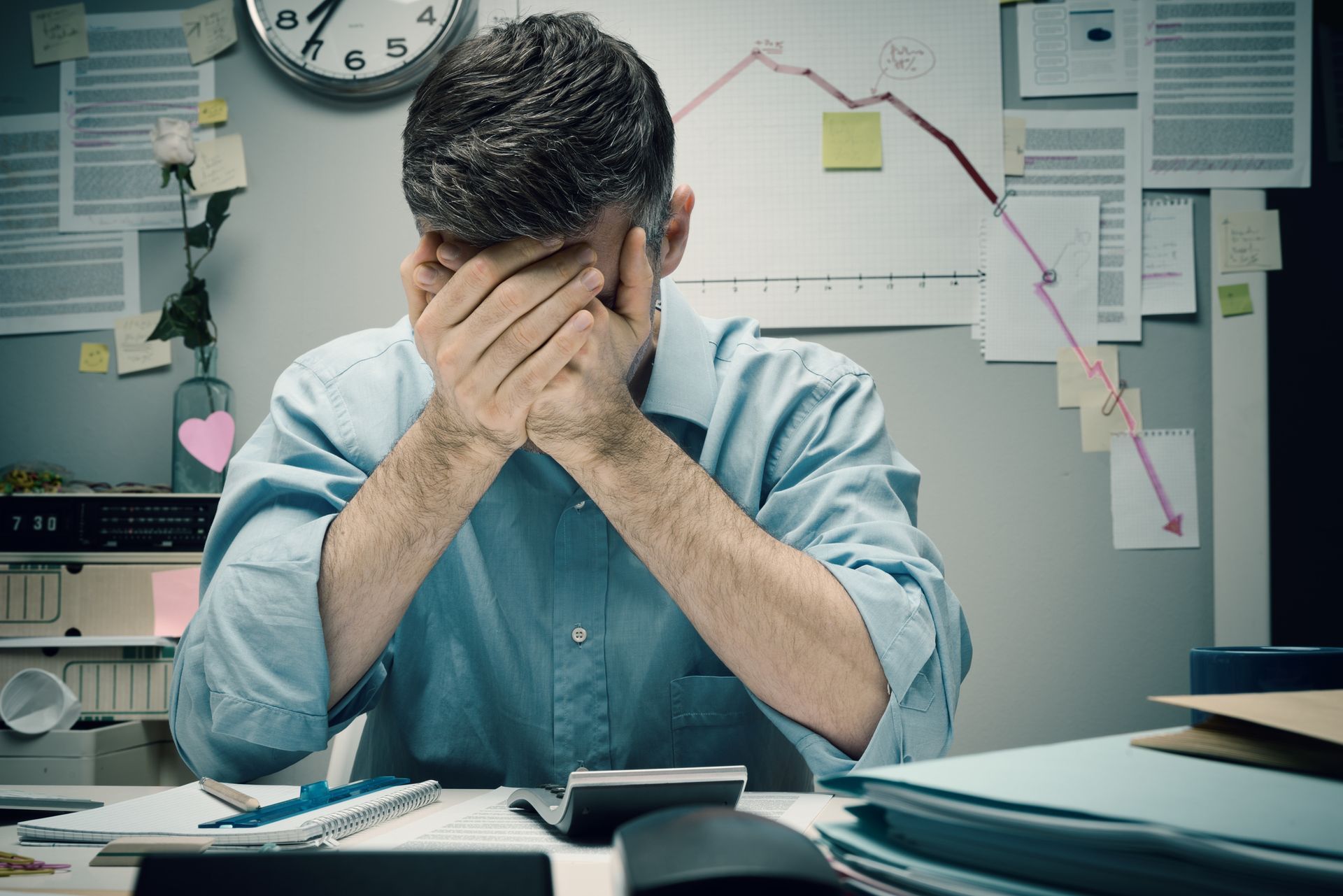 Stressed business owner at computer after Bench Accounting shutdown, searching for a new bookkeeper