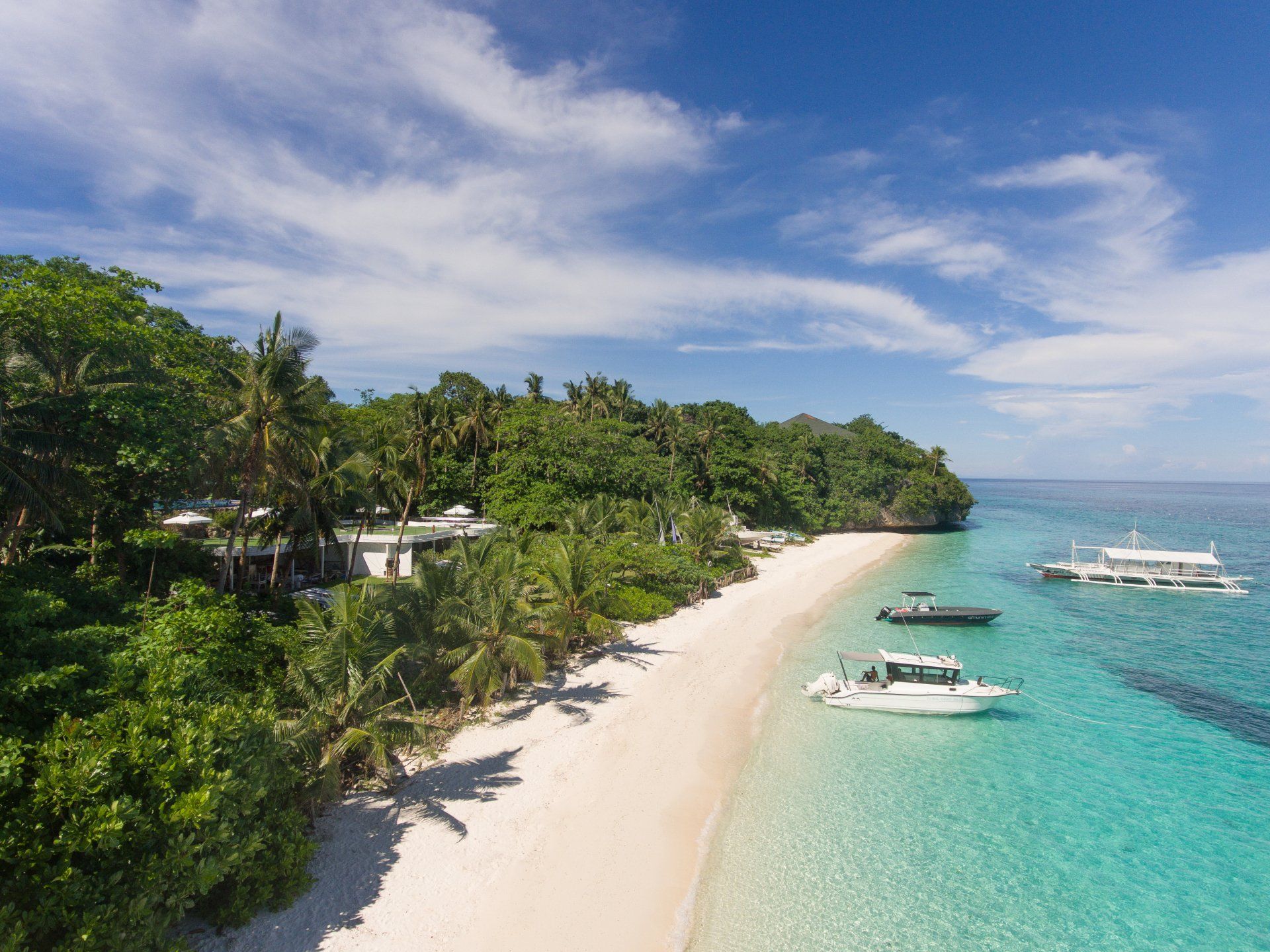 Secluded white-sand beach and turquoise waters at Amun Ini in Bohol.