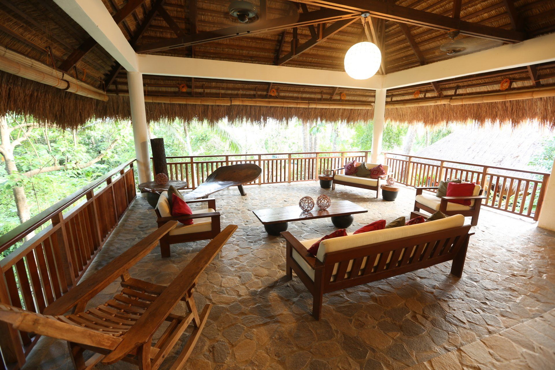 Amun Ini open-air reception area with native architecture and garden views.