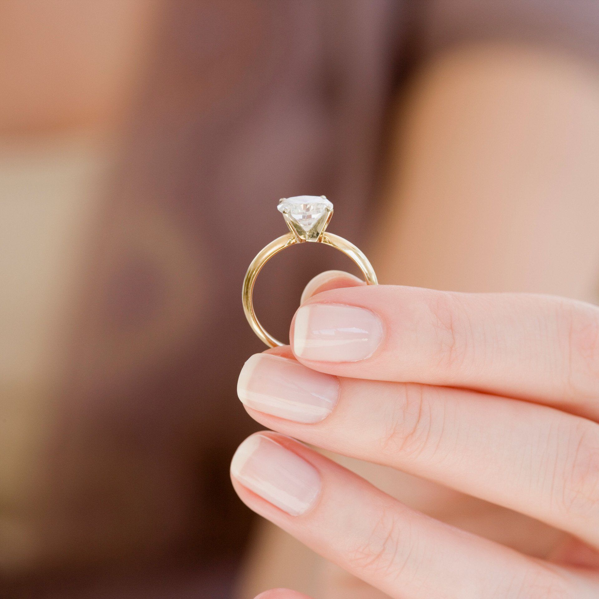 Woman holding engagement ring