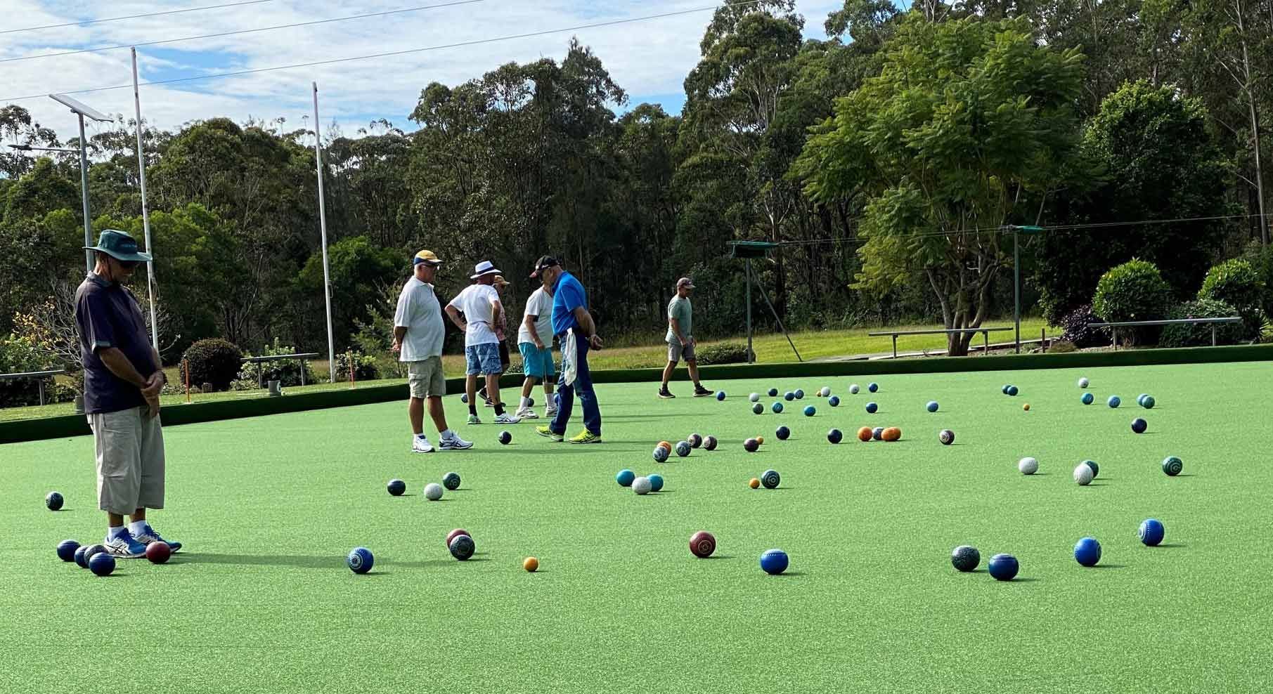 A Group Of People Are Playing A Game Of Bowling On A Green Field — Pacific Palms Bowling Club In Smiths Lake, NSW