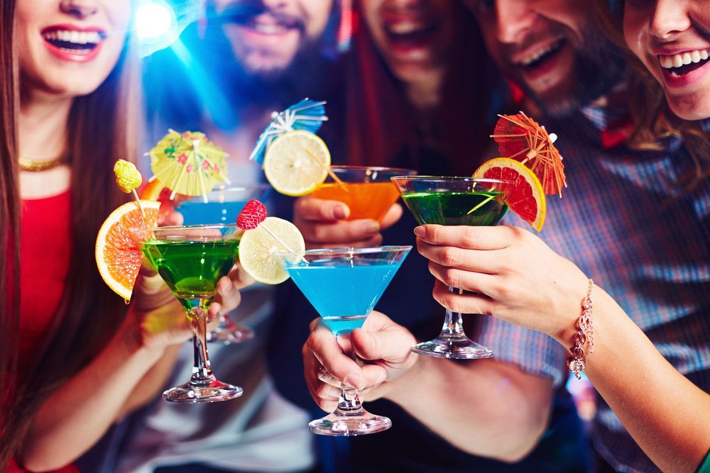 A Group Of People Are Toasting With Cocktails At A Party — Pacific Palms Bowling Club In Smiths Lake, NSW