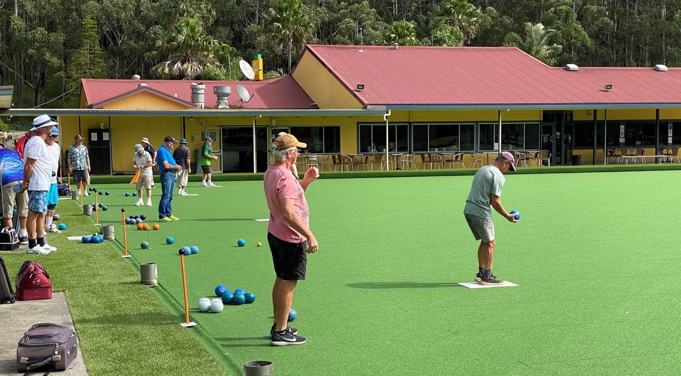 A Group Of People Are Playing A Game Of Bowling On A Lush Green Field — Pacific Palms Bowling Club In Smiths Lake, NSW