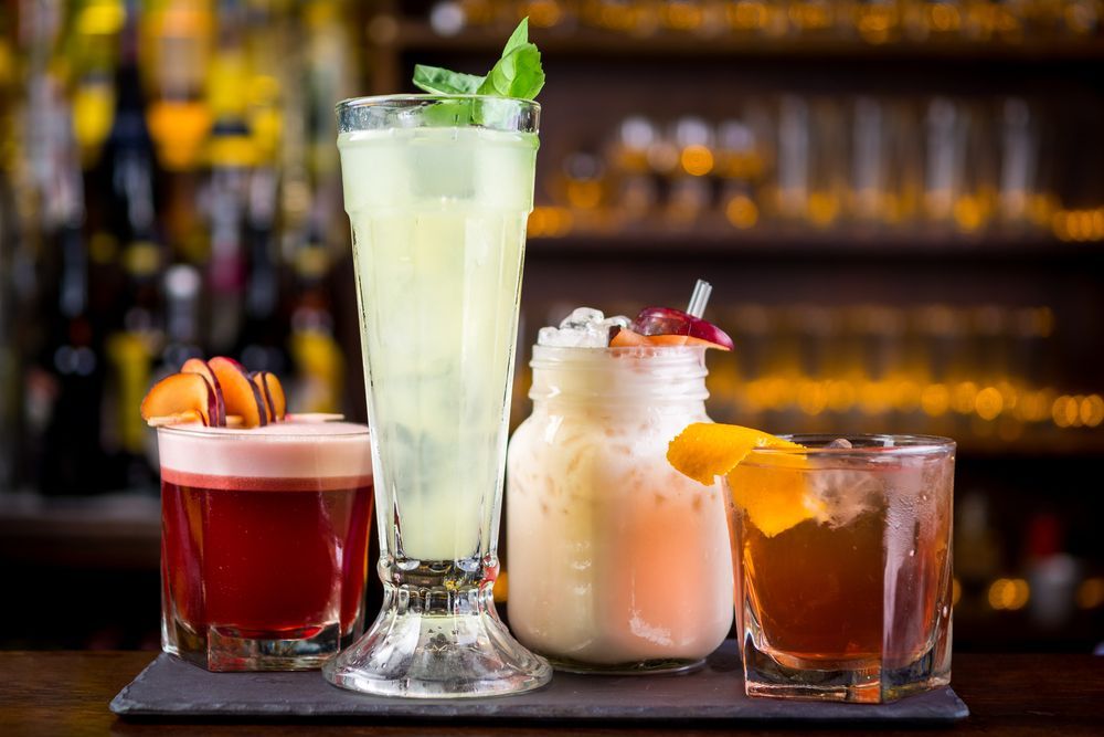 Four Different Types of Drinks Are Sitting on a Tray on a Bar — Pacific Palms Bowling Club In Smiths Lake, NSW