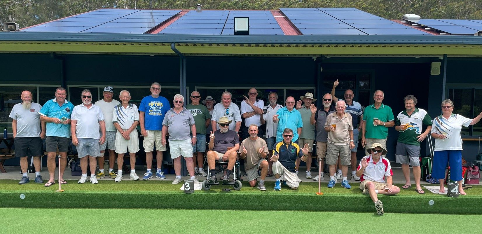 A Group Of Men Wearing Yellow And Green Shirts Are Posing For A Picture — Pacific Palms Bowling Club In Smiths Lake, NSW