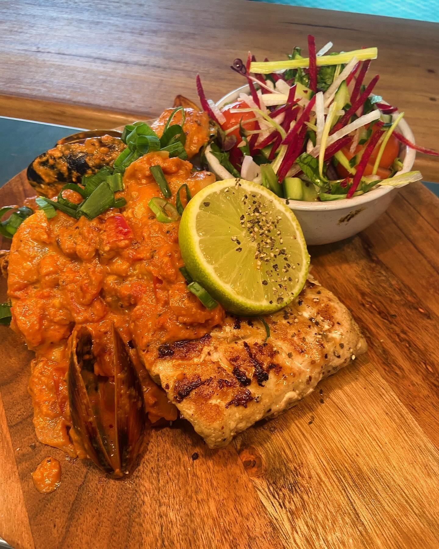 A Chicken Sandwich And French Fries On A Wooden Table — Pacific Palms Bowling Club In Smiths Lake, NSW