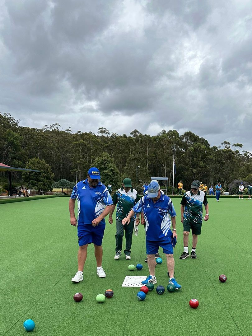 A Group Of People Are Playing A Game Of Bowling On A Green Field  — Pacific Palms Bowling Club In Smiths Lake, NSW