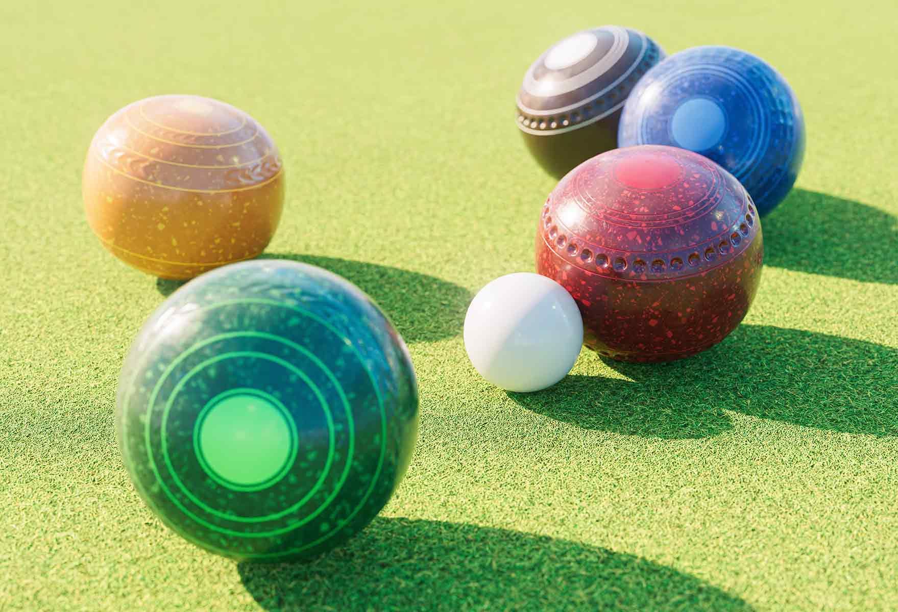 A Group Of Bowling Balls Are Sitting On Top Of A Green Field — Pacific Palms Bowling Club In Smiths Lake, NSW