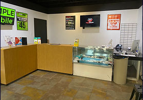 A store with a counter and a glass display case. — Champaign, JL — Renewal Development Inc A store with a counter and a glass display case. — Champaign, JL — Renewal Development Inc