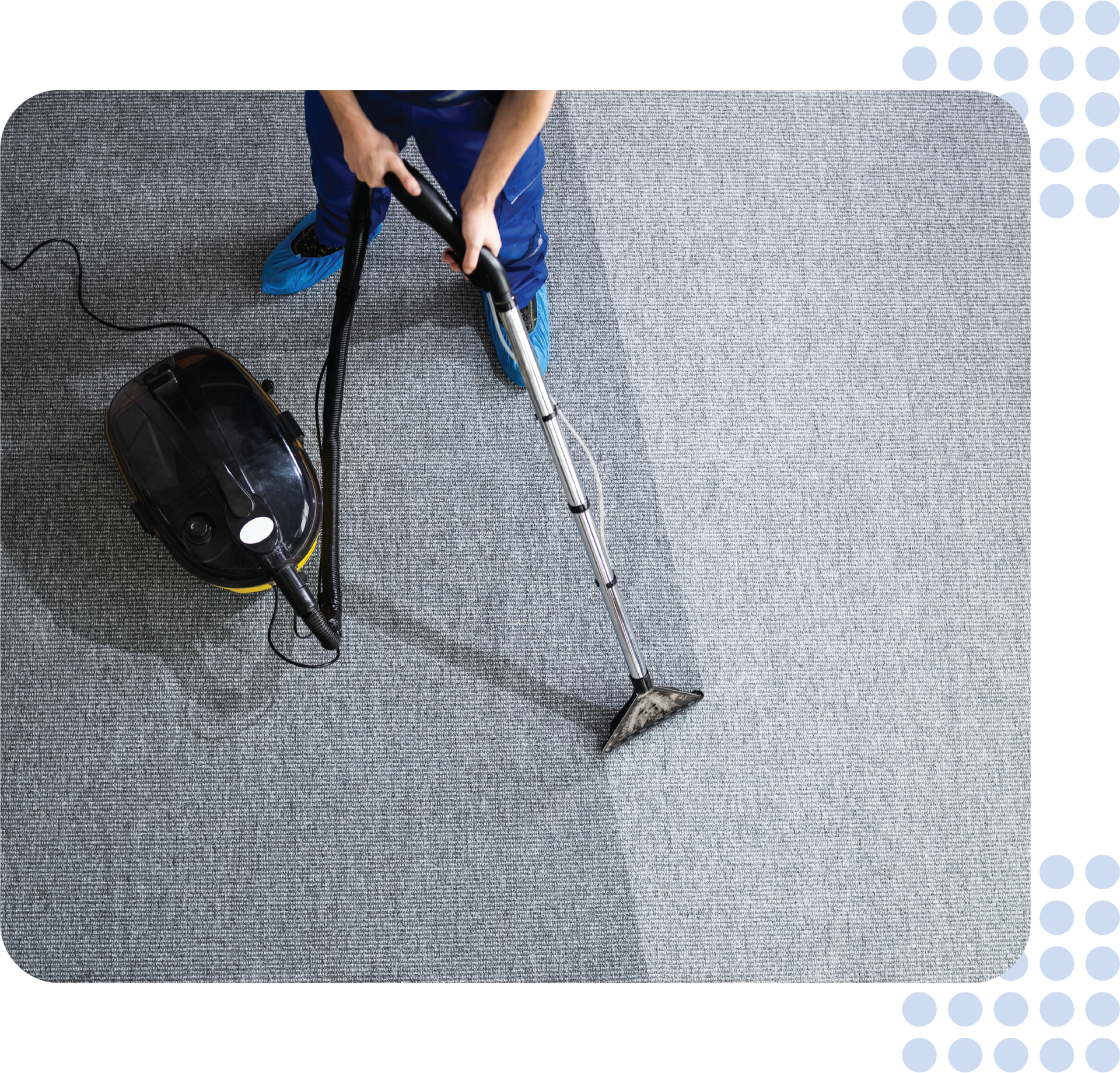 A person is using a vacuum cleaner to clean a carpet.