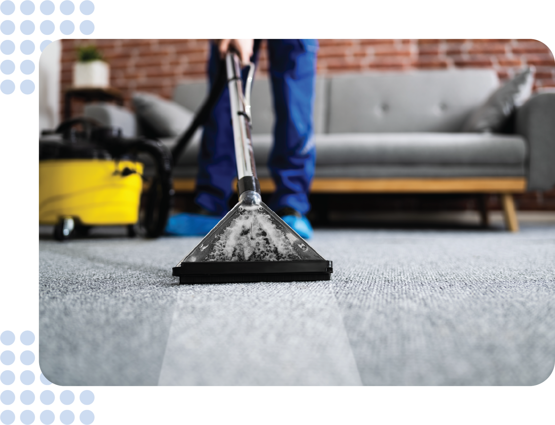 A person is cleaning a carpet with a vacuum cleaner in a living room.