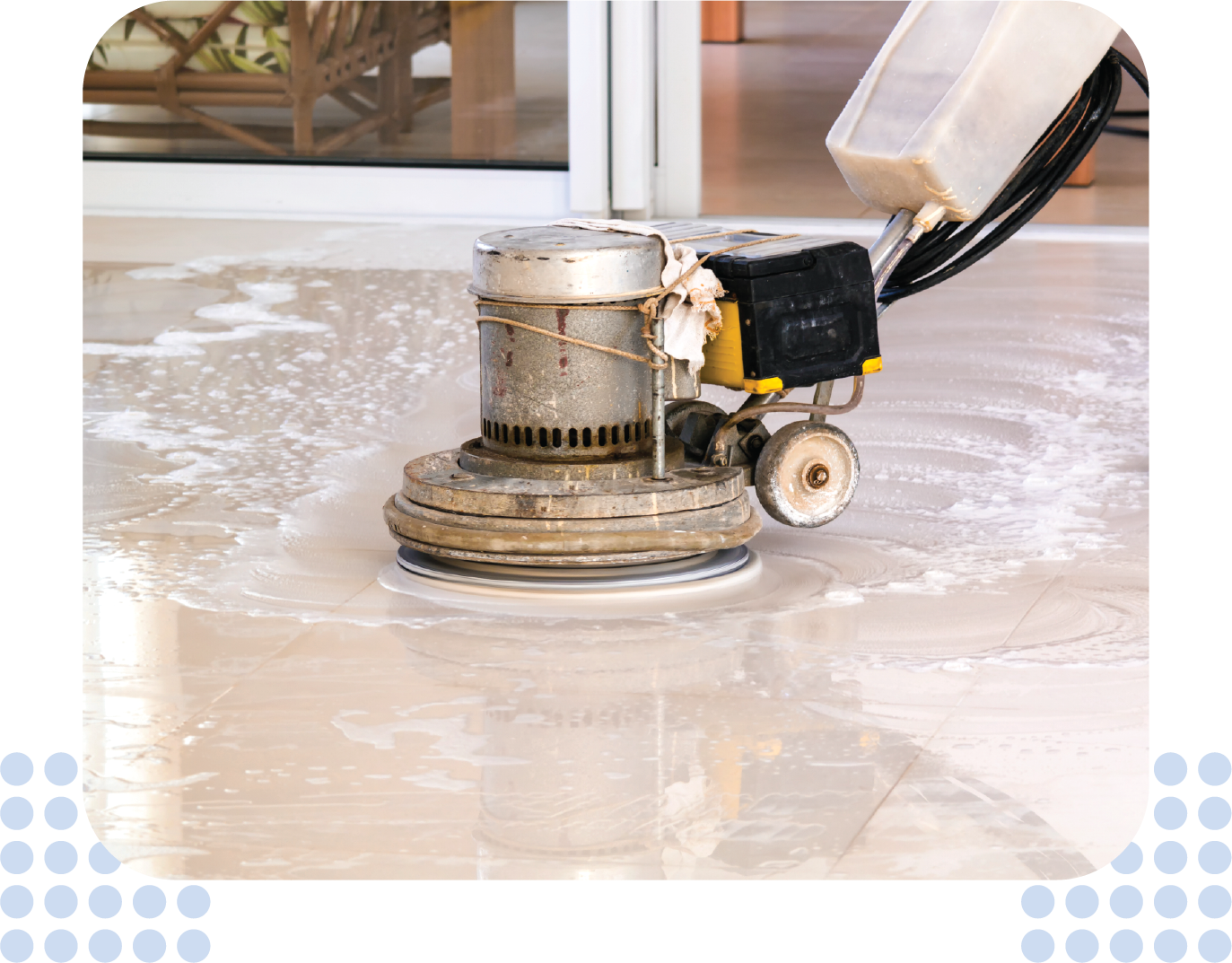 A person is using a machine to clean a marble floor.