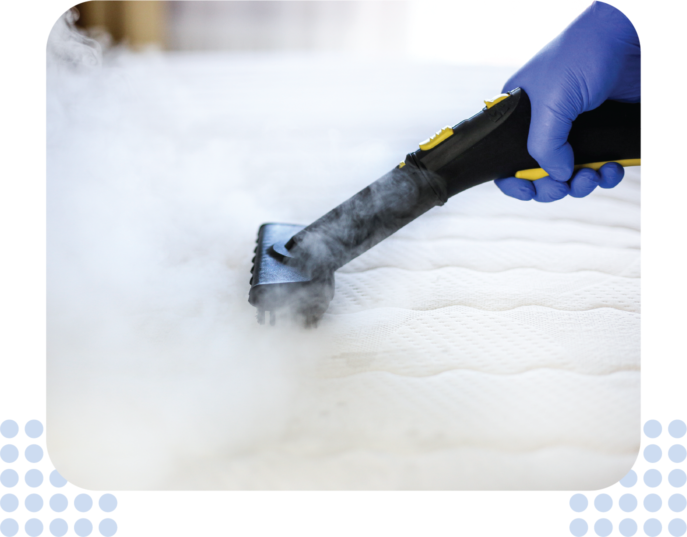 A person is cleaning a mattress with a steam cleaner.