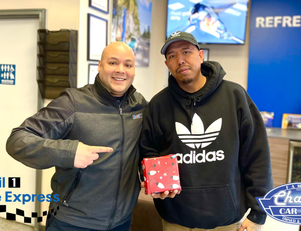 A Man With an Award in Charlie Car Care & Lube in Elgin, IL