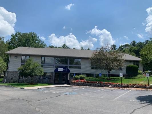 Modern warehouse space featuring one loading dock, 14-foot ceilings, and a small finished office area. The building includes new LED lighting, gas heat, and ample parking for trucks. Ideal for light manufacturing or storage.