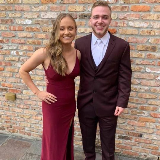 Young Couple Smiling Wearing Dress and Tuxedo — Mandeville, LA — Tophat Tuxedo