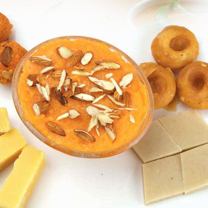 A bowl of food with almonds on top of it