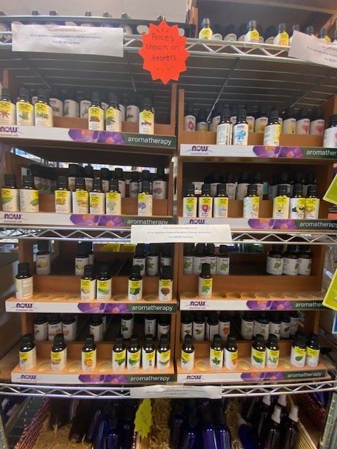 A shelf full of bottles of acai vitamins