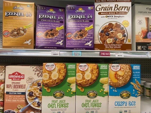 Boxes of cereal on a shelf including grain berry