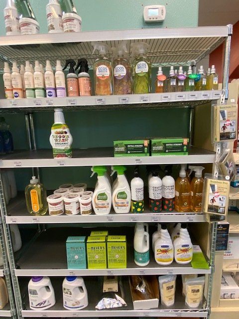 A shelf filled with lots of cleaning products in a store.