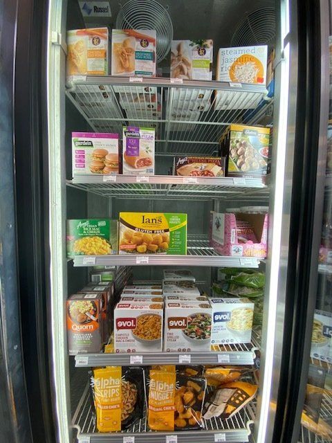 A refrigerator filled with a variety of frozen foods.