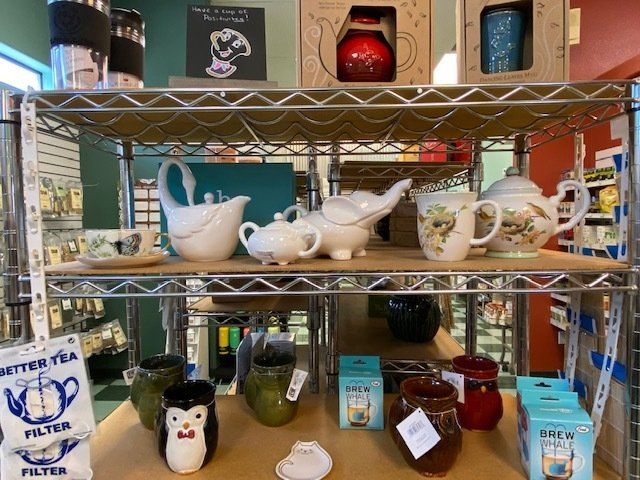 A display of tea pots and cups in a store