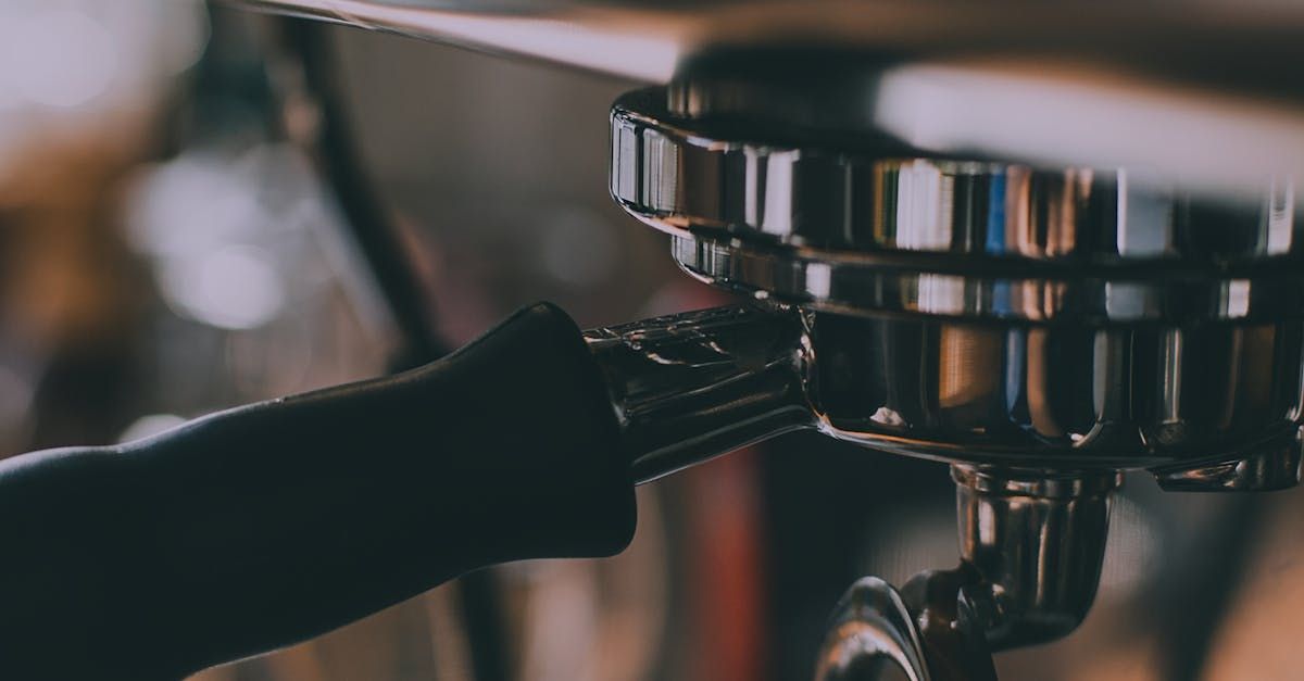 A close up of a coffee machine being used to make coffee.