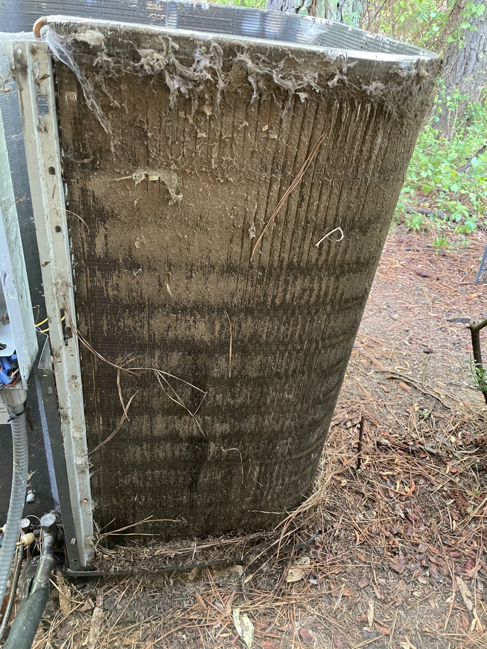 An old AC unit that was poorly maintained and needs replaced