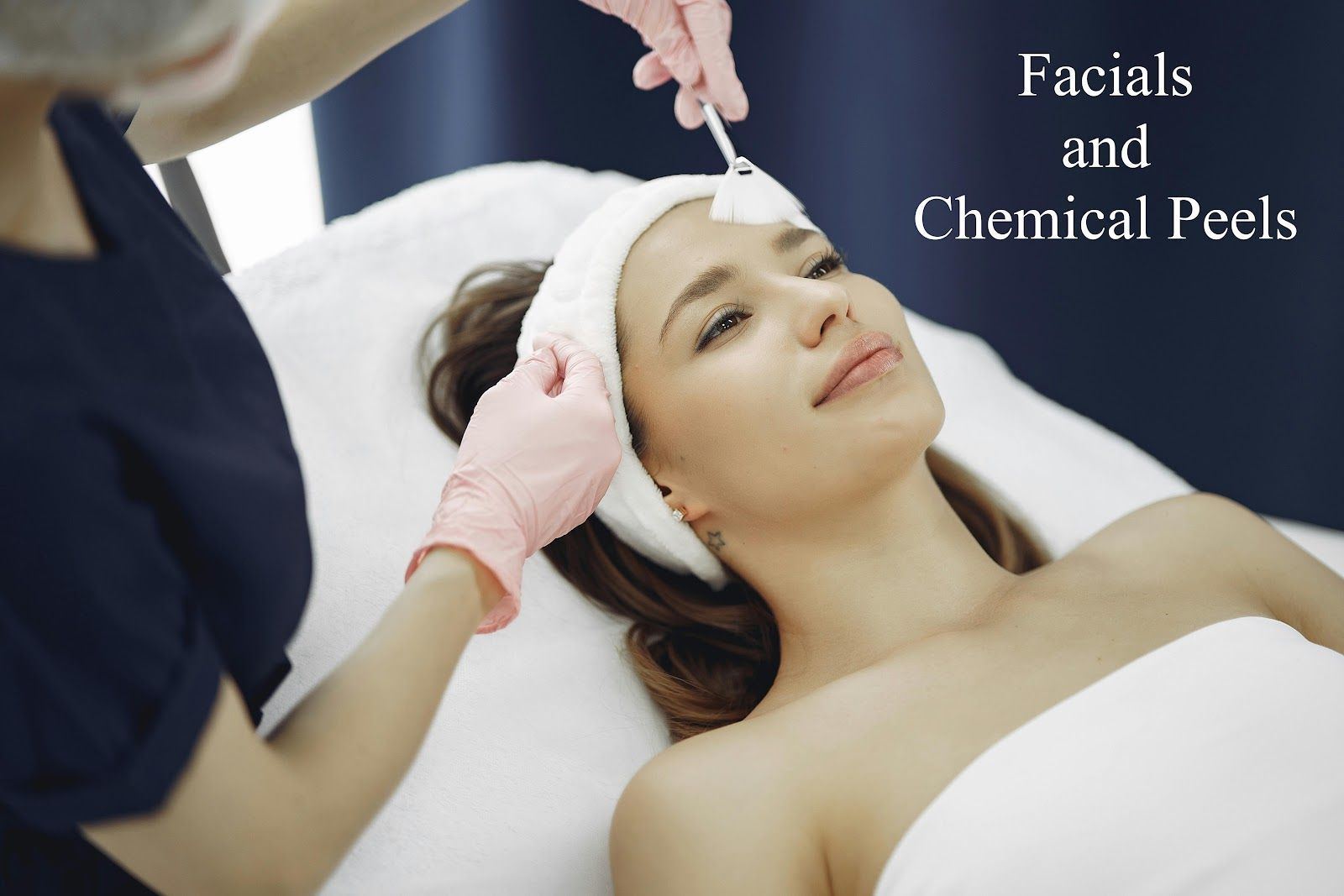 A woman is getting a facial and chemical peel at a spa.