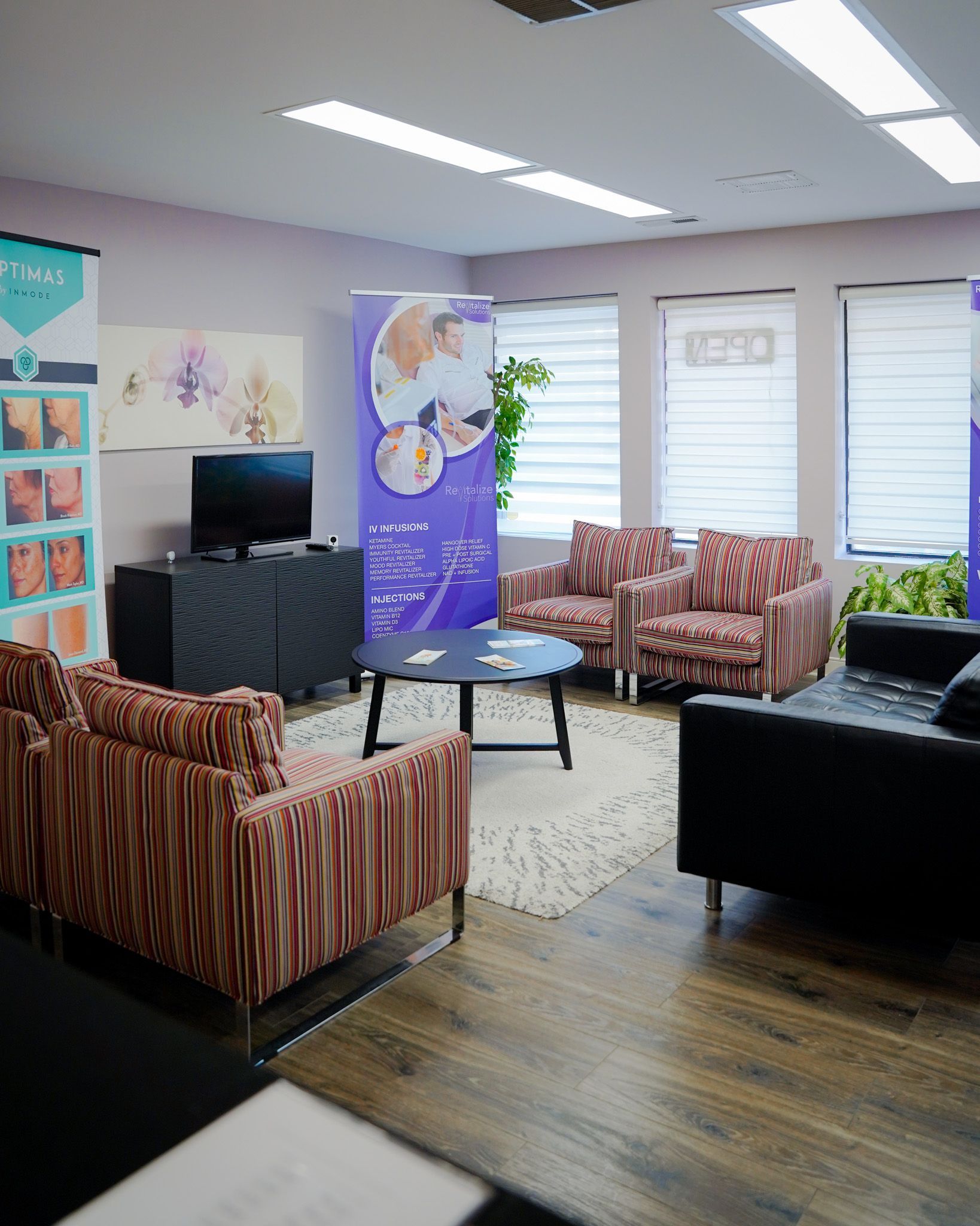 A living room filled with furniture and a television.