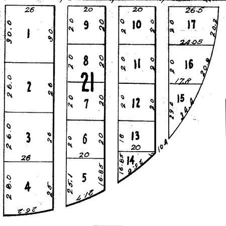 Diagram of numbered rectangular and trapezoidal lots, showing dimensions and a central lot marked 
