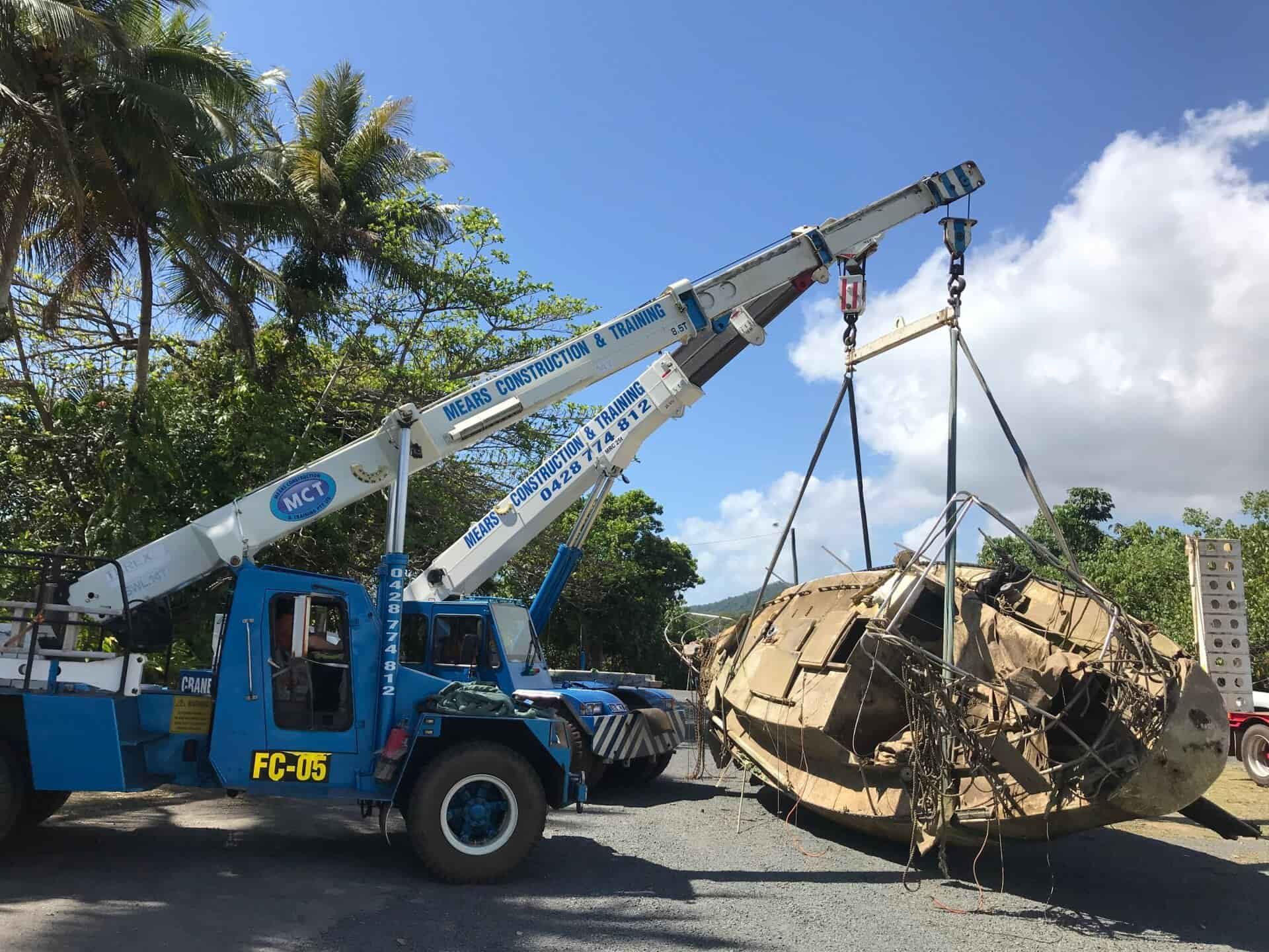 Two Blue Cranes Lifting A Large, Round, Metal Object — Mears Construction & Training Pty Ltd in South Johnstone, QLD