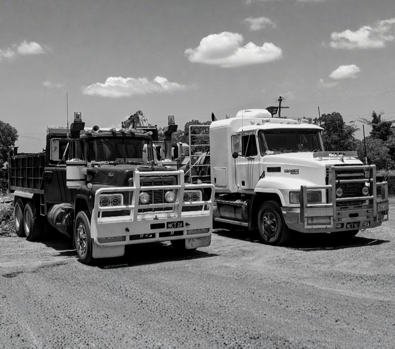 Yellow Dump Truck Unloading Soil At A Construction Site — Mears Construction & Training Pty Ltd in South Johnstone, QLD