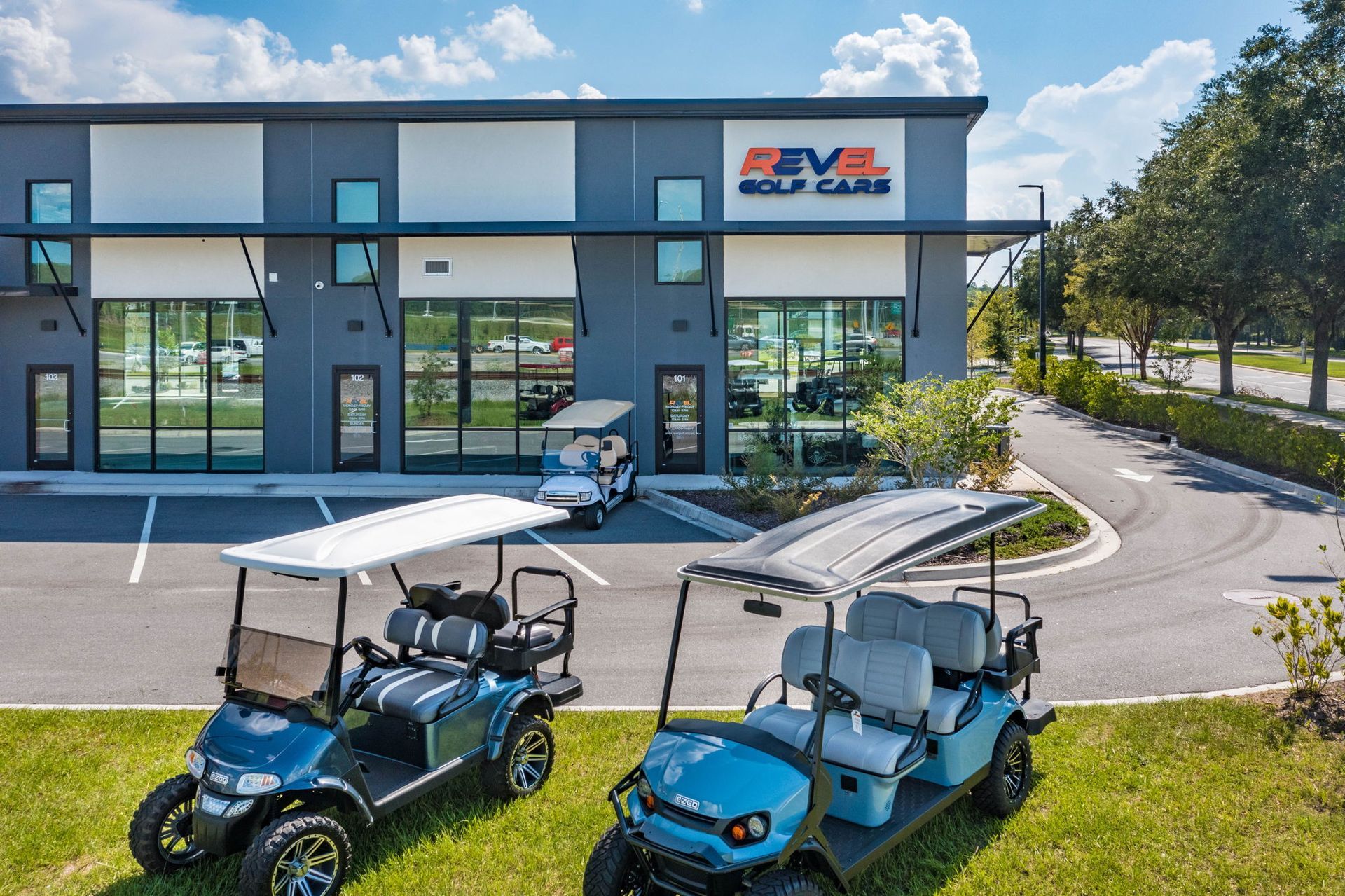 Revel Store Front With 3 Blue Golf Carts In Front — Jacksonville, FL — Hatchett Electrical Contracting
