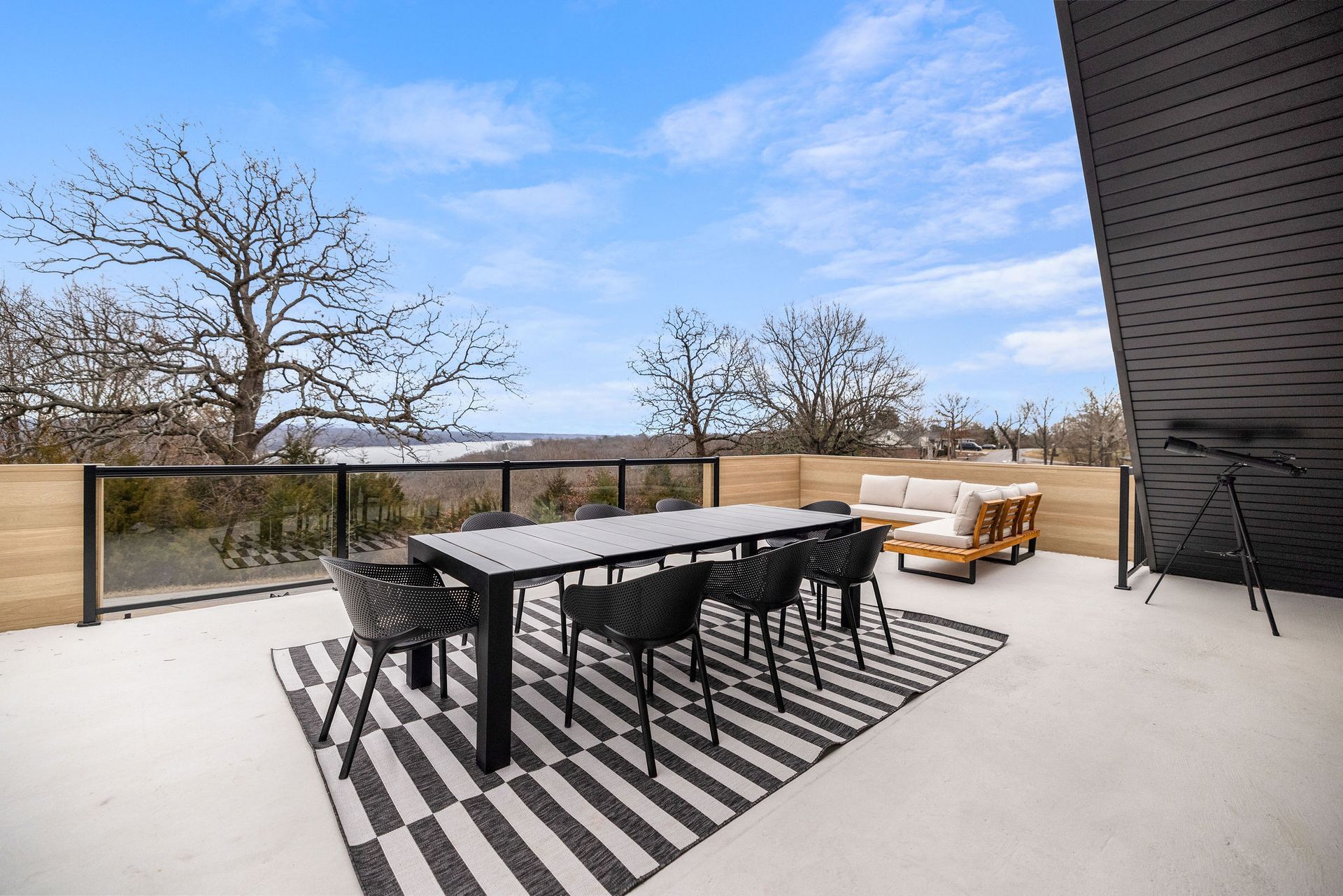 Dining table on the patio that seats 8. Perfect for a meal overlooking Beaver Lake.
