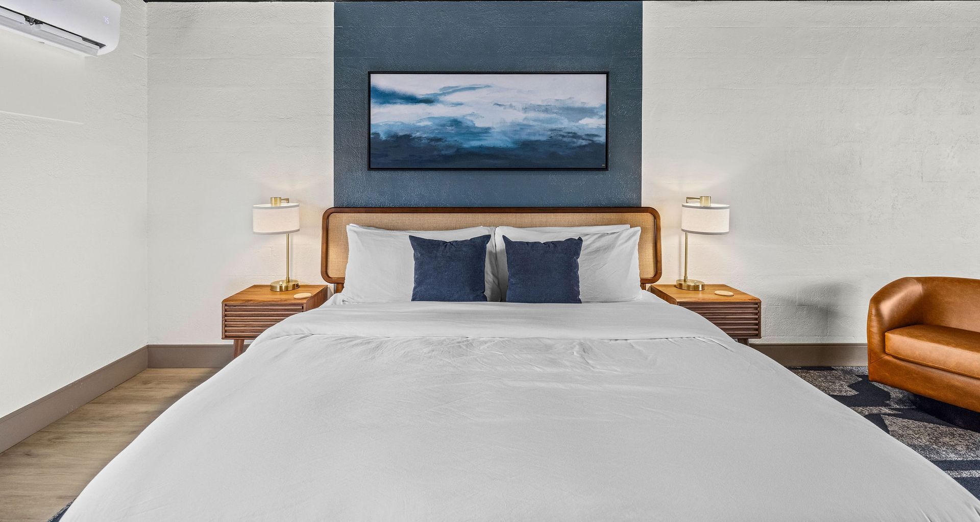 A kitchen with a table and chairs and a window.