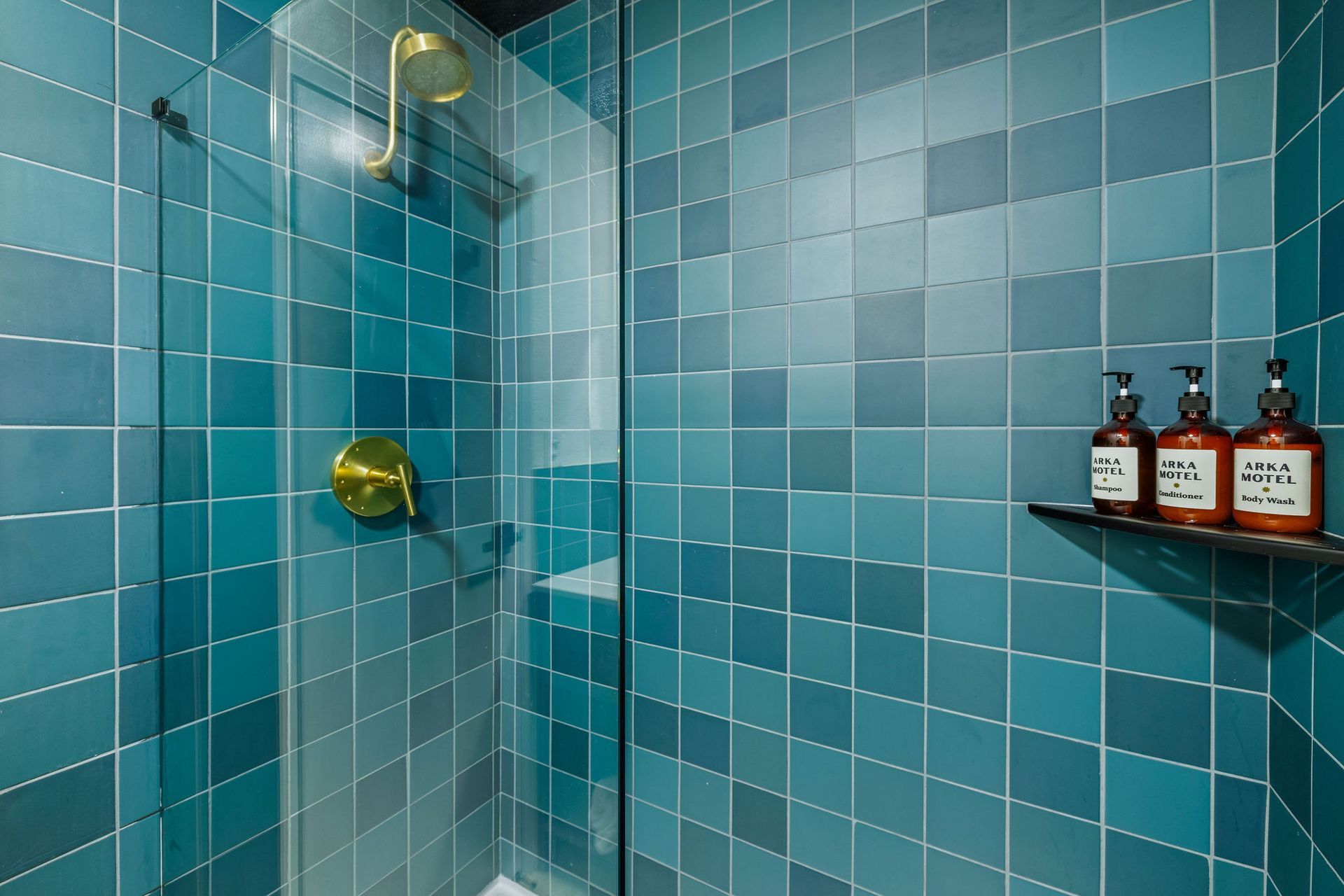 A bathroom with a toilet , sink and mirror