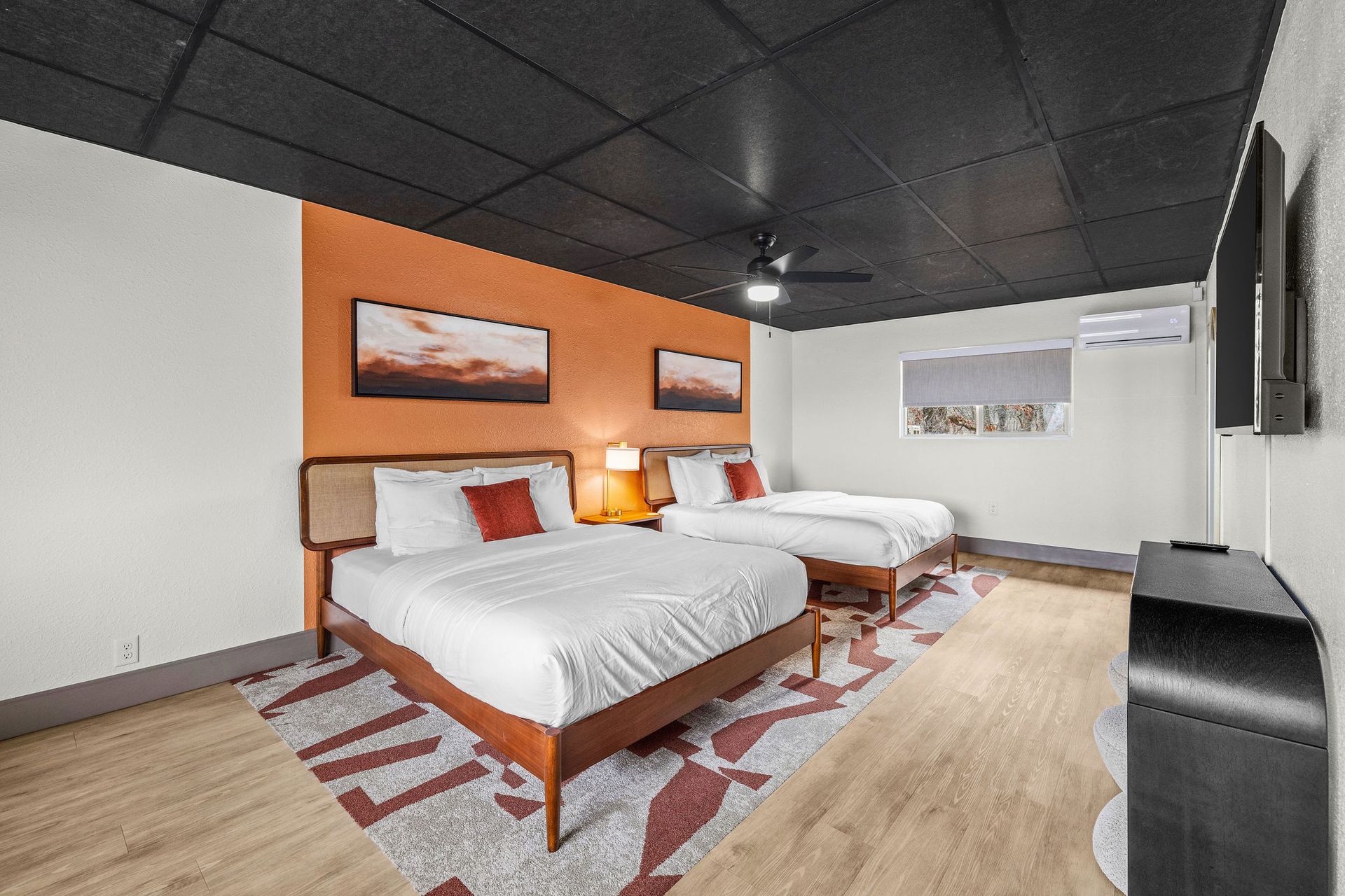 A bathroom with a toilet a sink and a mirror