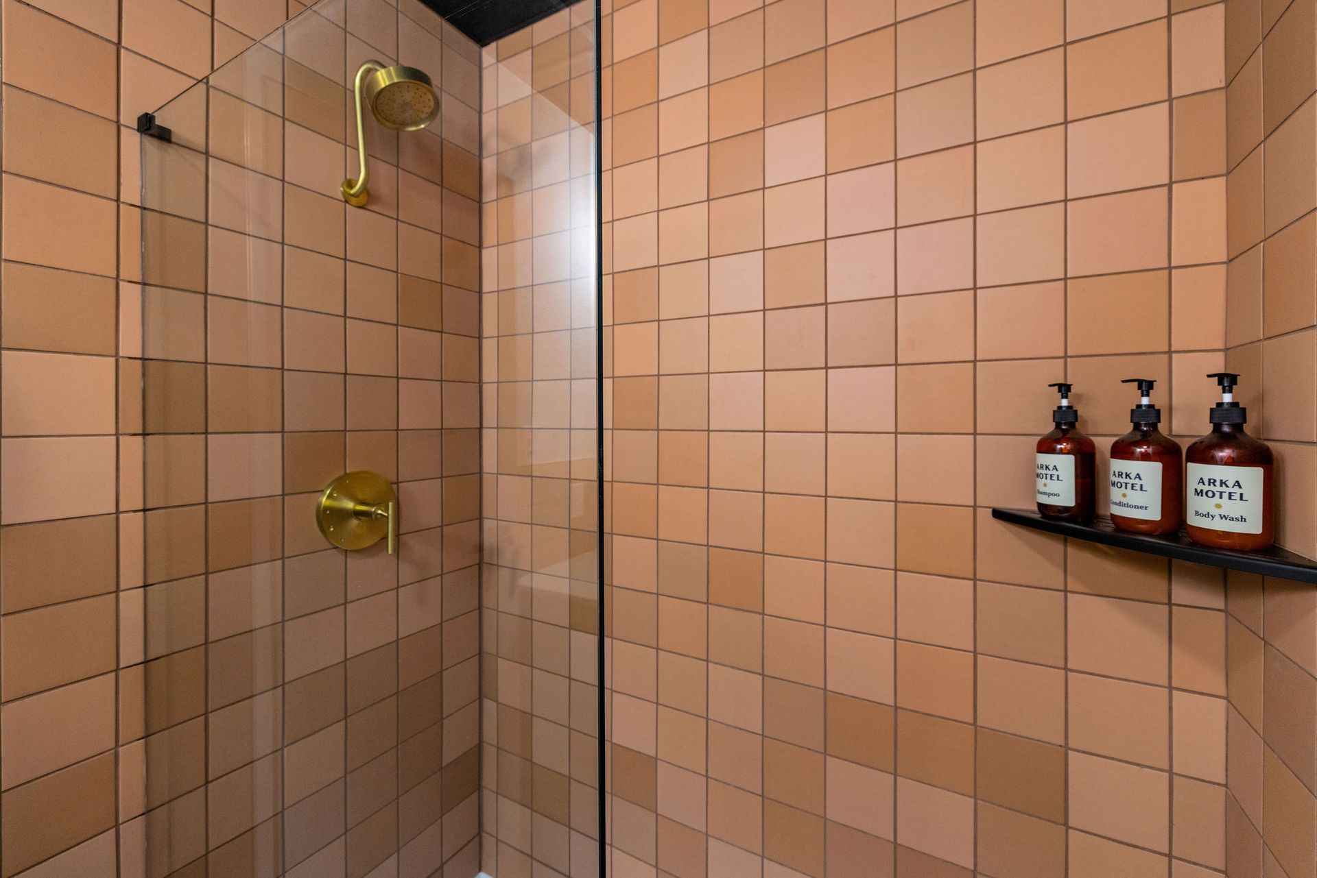 A hotel room with two beds and a flat screen tv.