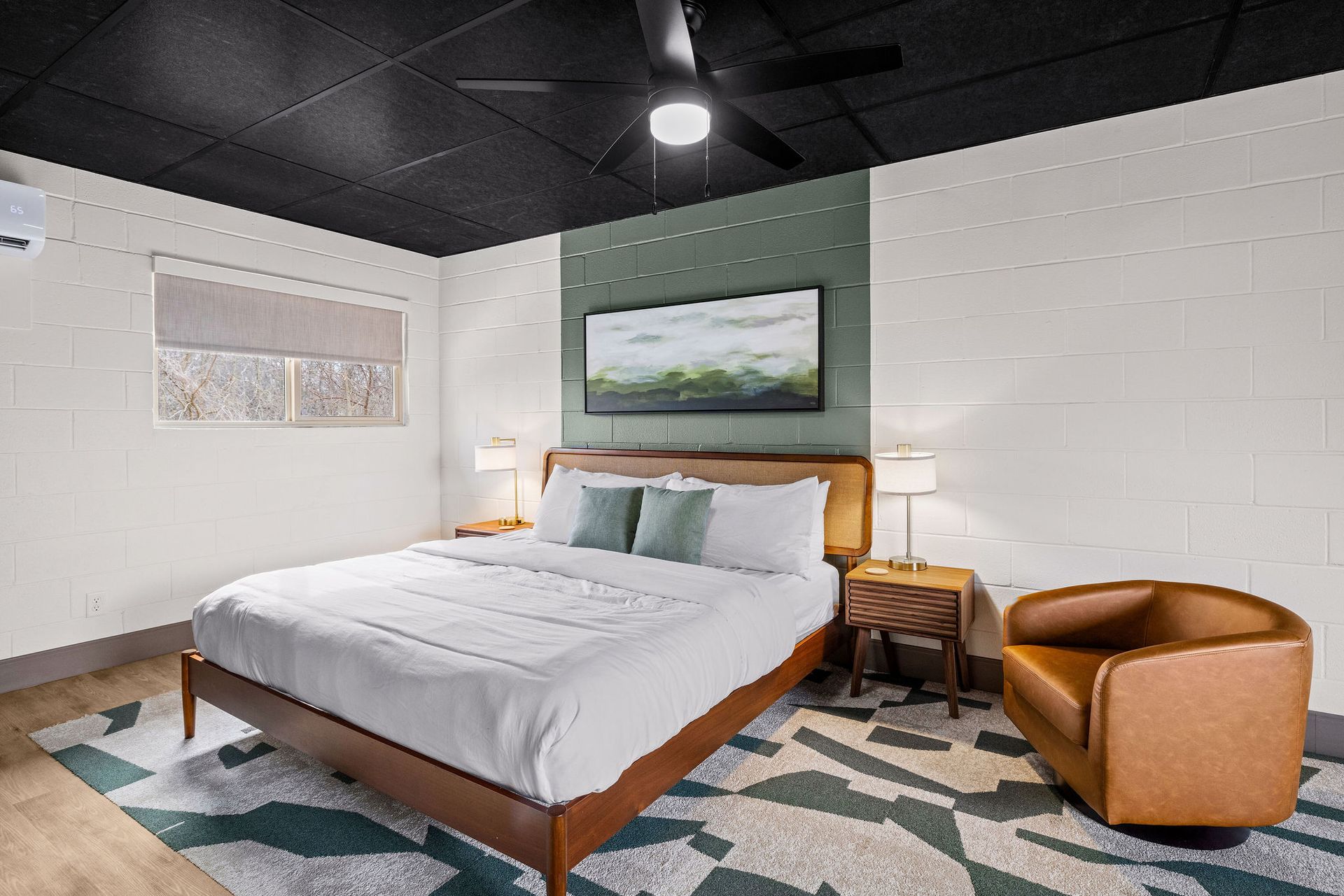 A lake surrounded by trees on a sunny day