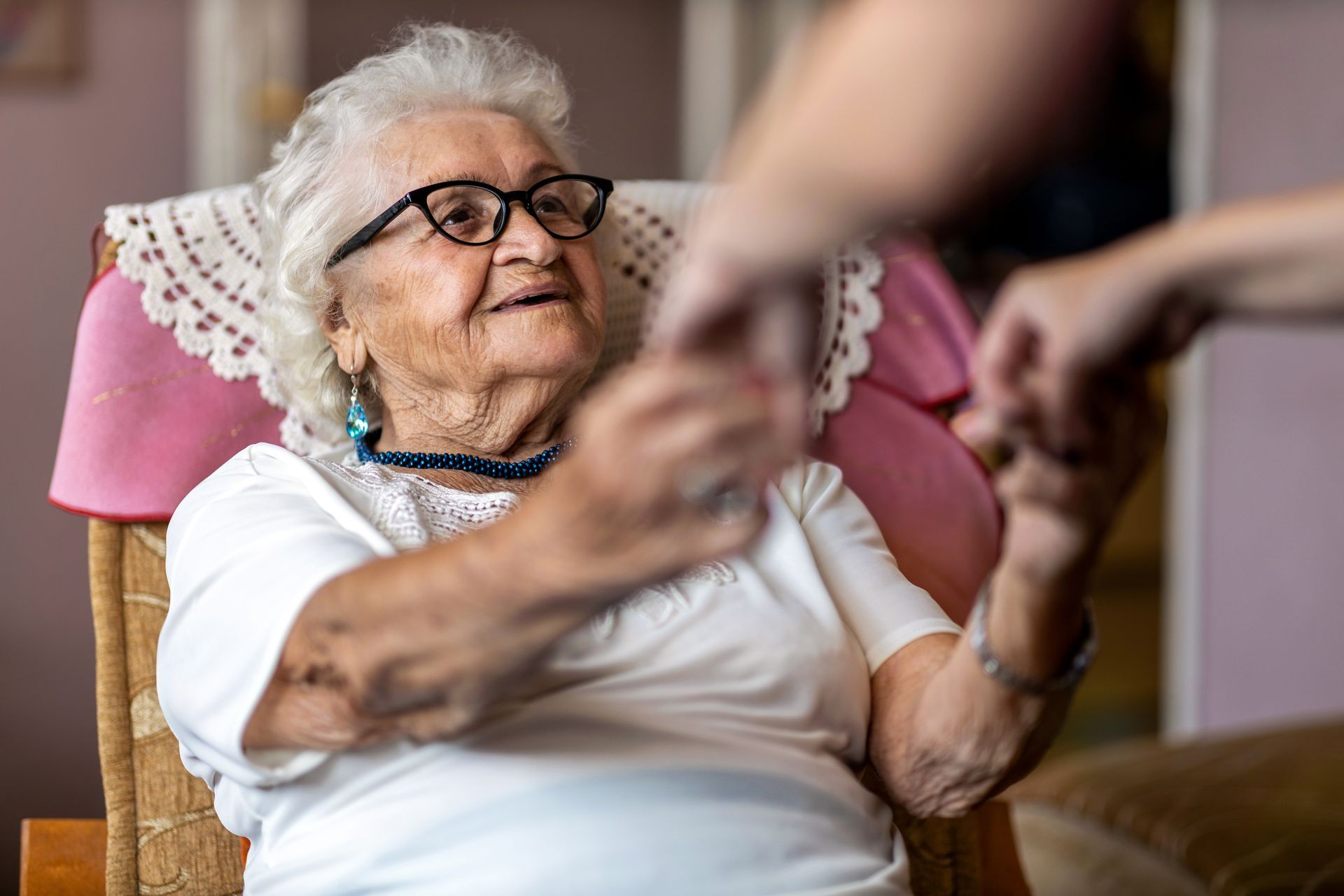 Elderly woman receiving gentle in-home care from a Companion Home Care support worker