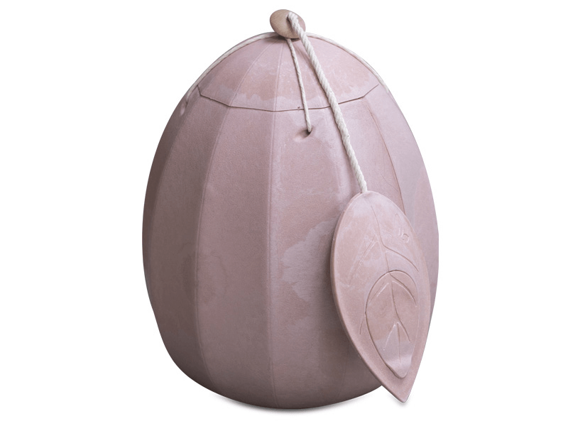 Egg-shaped urn with a leaf-shaped tag, light pink color, white background.