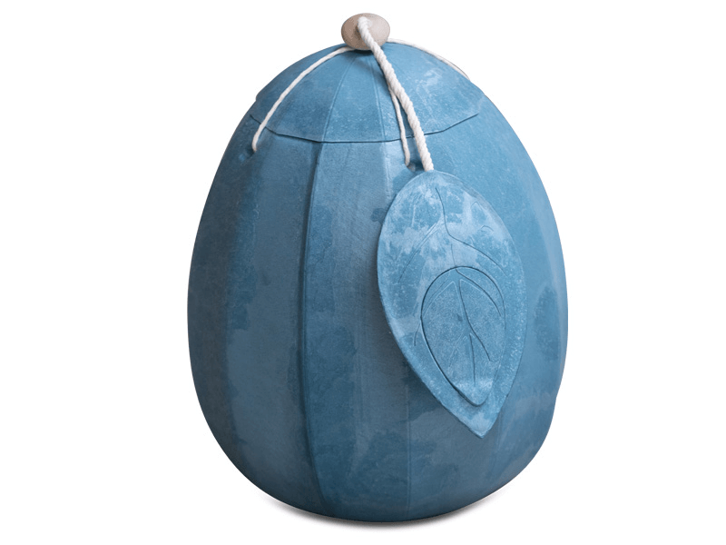Blue egg-shaped urn with a leaf-shaped tag, tied with white string.