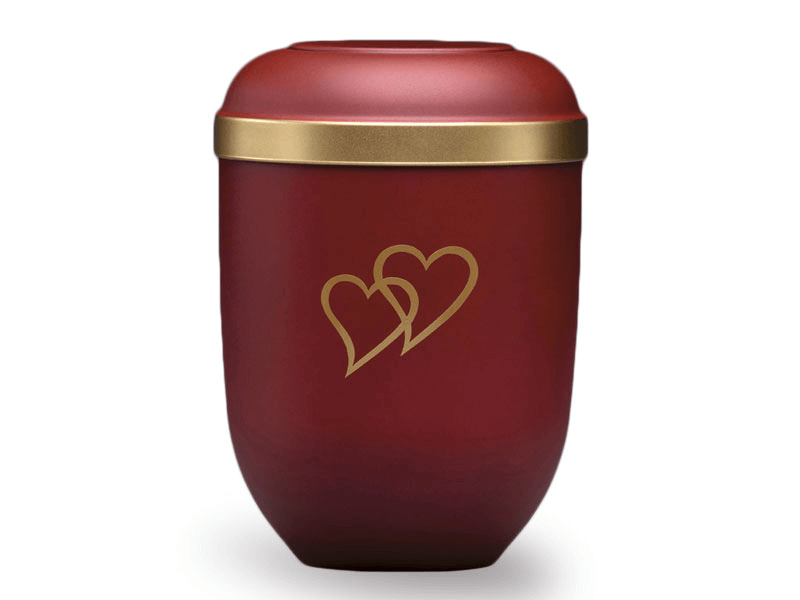 Red urn with two gold overlapping hearts and a gold band.