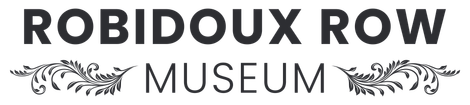 Robidoux Row Museum logo with black text and decorative floral flourishes on a light gray background