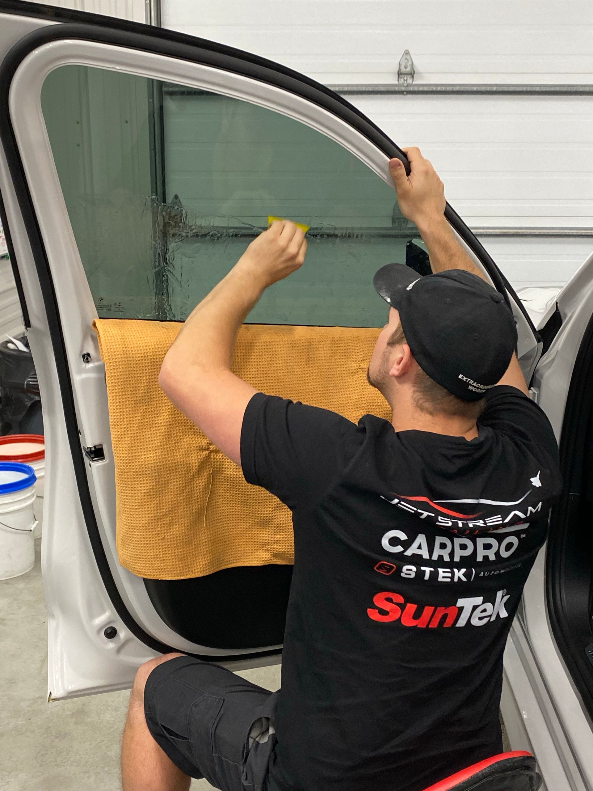 A man wearing a black shirt that says carpro on it