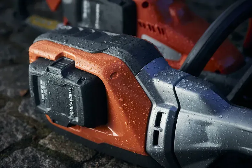 A Close up Of a Husqvarna Chainsaw with A Battery Attached to It — CBS Chainsaw & Brushcutter Specialists - HUSQVARNA in Wauchope, NSW