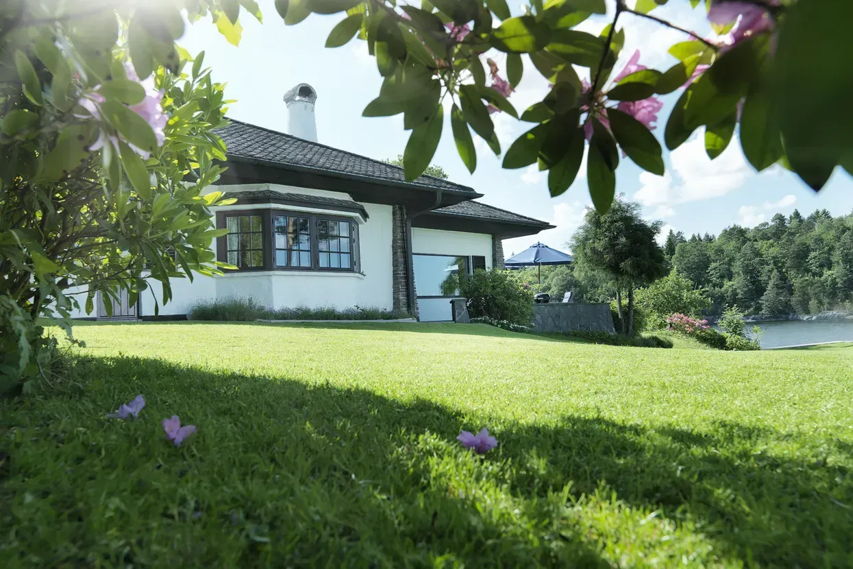 Beautiful Lawn And House — CBS Chainsaw & Brushcutter Specialists - HUSQVARNA in Wauchope, NSW