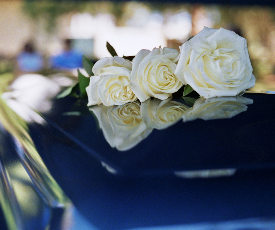 Roses on top of a casket at a prearranged funeral service. 